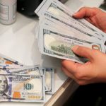 image-a-money-changer-counts-u-s-dollar-banknotes-at-a-currency-exchange-office-in-ankara